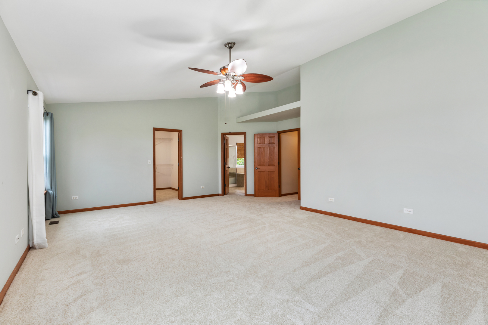 25231 Gettysburg Road Plainfield, IL 60544 - Photo 16 of 30 an empty room with chandelier fan and windows