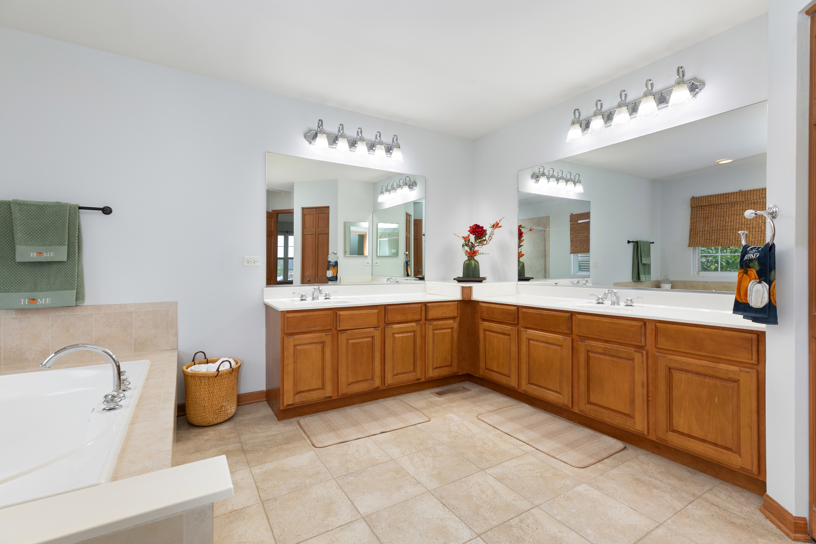 25231 Gettysburg Road Plainfield, IL 60544 - Photo 19 of 30 a spacious bathroom with a granite countertop sink and a mirror