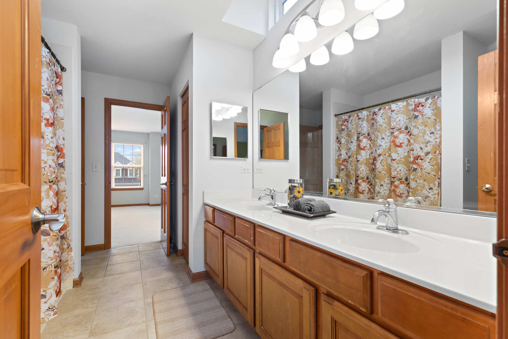 25231 Gettysburg Road Plainfield, IL 60544 - Photo 24 of 30 a spacious bathroom with double vanity and a mirror