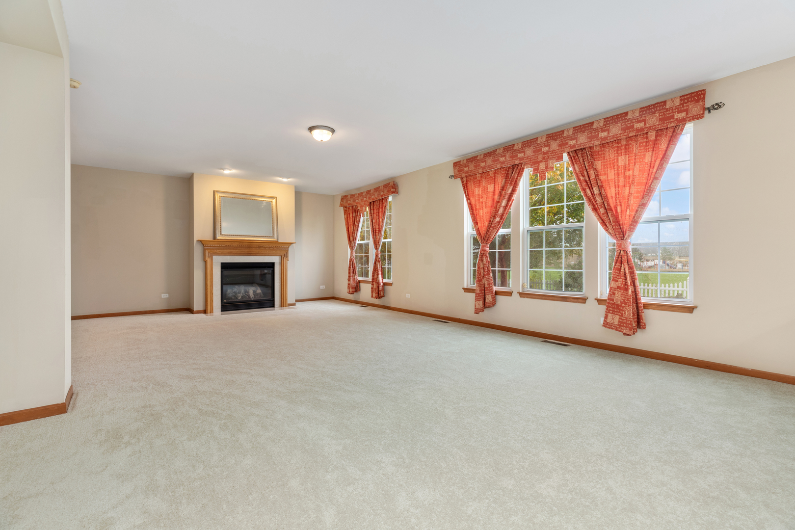 25231 Gettysburg Road Plainfield, IL 60544 - Photo 10 of 30 an empty room with windows and fireplace