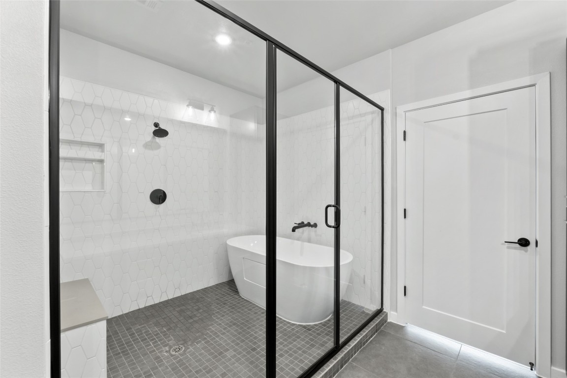 4510 Terry-O Lane, Unit 230 Austin, TX 78745 - Photo 10 of 39 a bathroom with a glass shower door