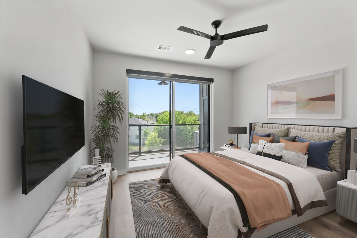 4510 Terry-O Lane, Unit 230 Austin, TX 78745 - Photo 12 of 39 a bedroom with a large bed and a flat tv screen on dresser