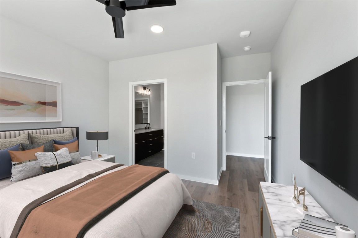 4510 Terry-O Lane, Unit 230 Austin, TX 78745 - Photo 13 of 39 a bedroom with a bed and a flat screen tv