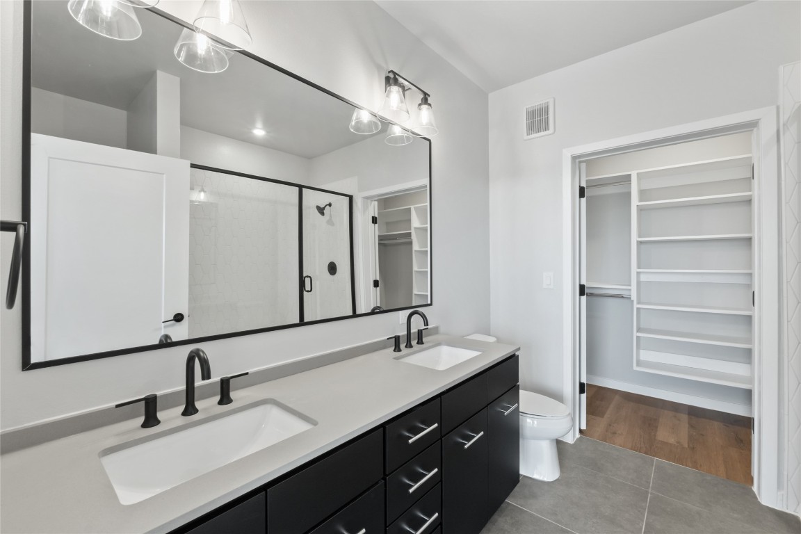 4510 Terry-O Lane, Unit 230 Austin, TX 78745 - Photo 14 of 39 a bathroom with a double vanity sink mirror and double