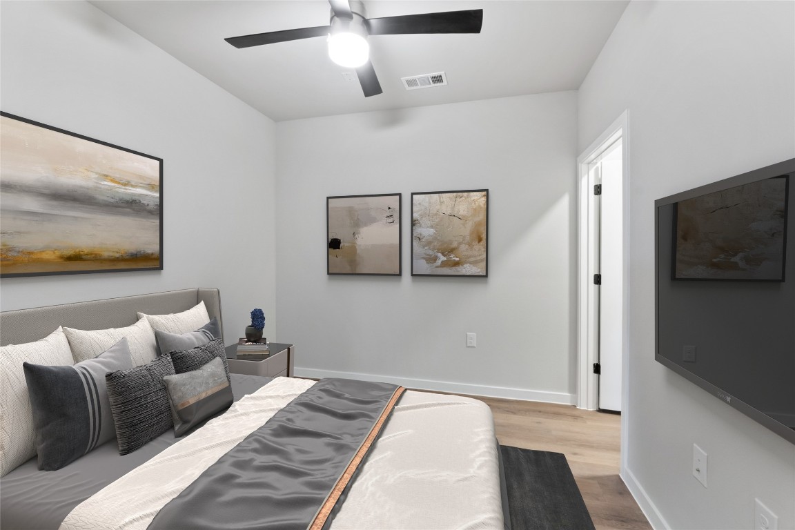 4510 Terry-O Lane, Unit 230 Austin, TX 78745 - Photo 18 of 39 a bedroom with a bed and a painting on the wall