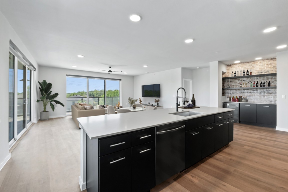 4510 Terry-O Lane, Unit 230 Austin, TX 78745 - Photo 38 of 39 a kitchen with kitchen island granite countertop a sink counter top space and stainless steel appliances