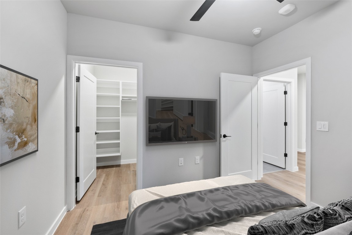 4510 Terry-O Lane, Unit 230 Austin, TX 78745 - Photo 19 of 39 a bedroom with a bed and a view of bathroom