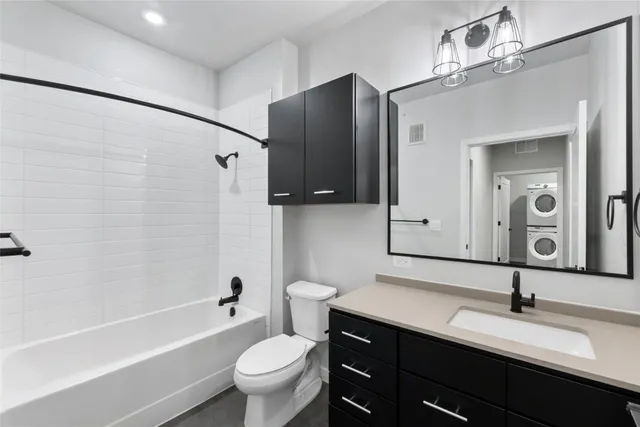 a bedroom with a bed and a view of bathroom