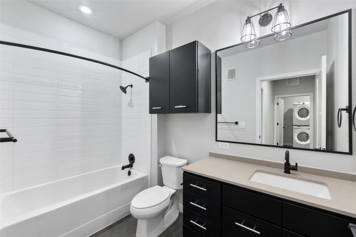 4510 Terry-O Lane, Unit 230 Austin, TX 78745 - Photo 21 of 39 a bathroom with a granite countertop sink toilet and shower