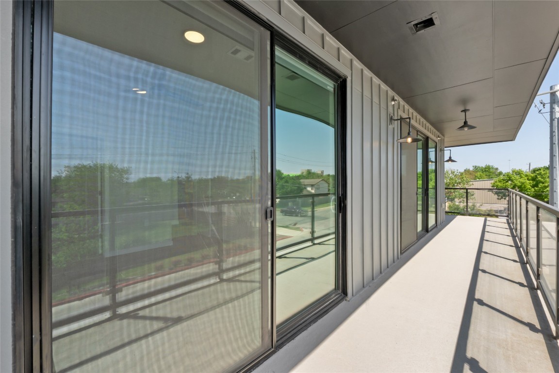 4510 Terry-O Lane, Unit 230 Austin, TX 78745 - Photo 26 of 39 a balcony with view of wooden floor