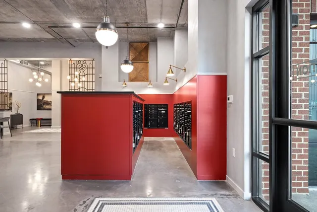a living room with furniture a rug and a fireplace