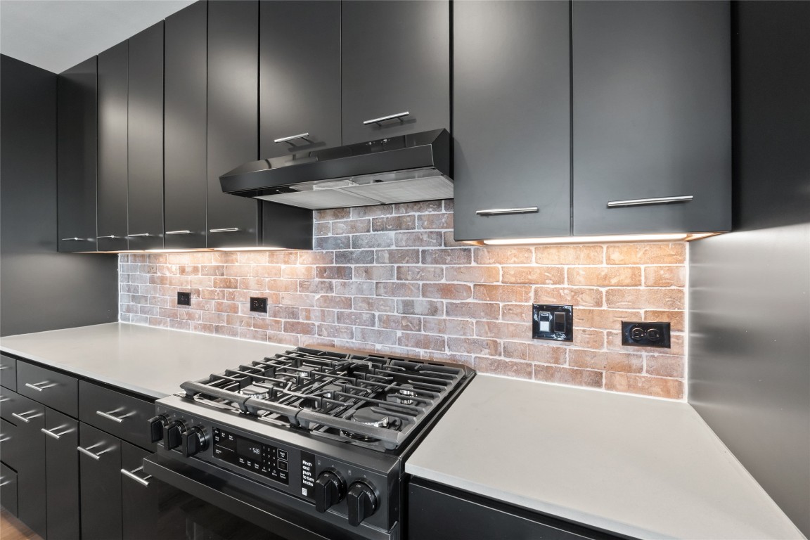 4510 Terry-O Lane, Unit 230 Austin, TX 78745 - Photo 2 of 39 a kitchen with granite countertop a stove and a refrigerator