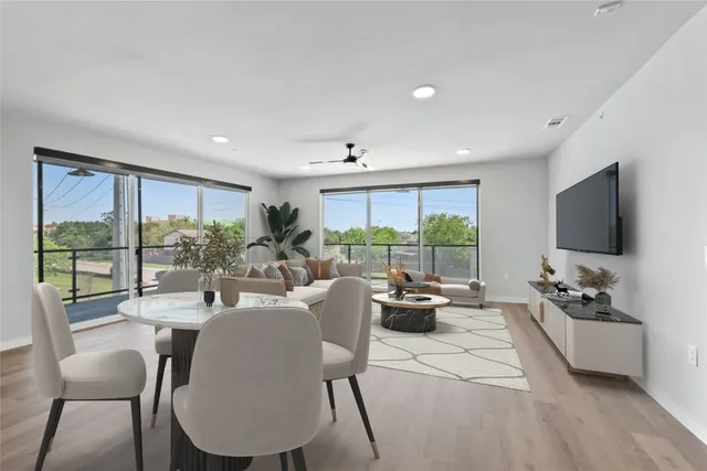 a kitchen with stainless steel appliances kitchen island granite countertop a sink and cabinets