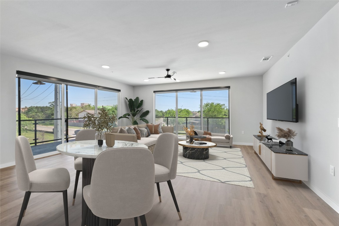 4510 Terry-O Lane, Unit 230 Austin, TX 78745 - Photo 3 of 39 a living room with furniture large windows and a flat screen tv