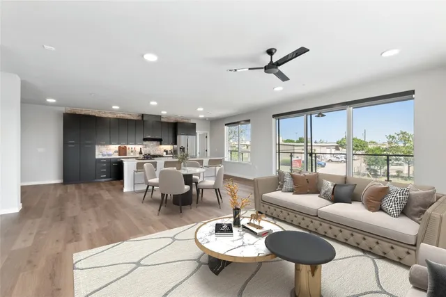 a kitchen with granite countertop a stove and a refrigerator