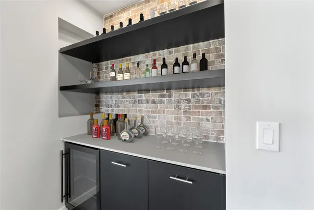 a living room with furniture large windows and a flat screen tv