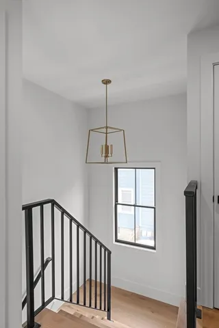 a view of a hallway with windows