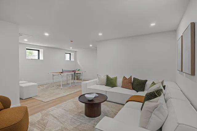 a living room with furniture and a table