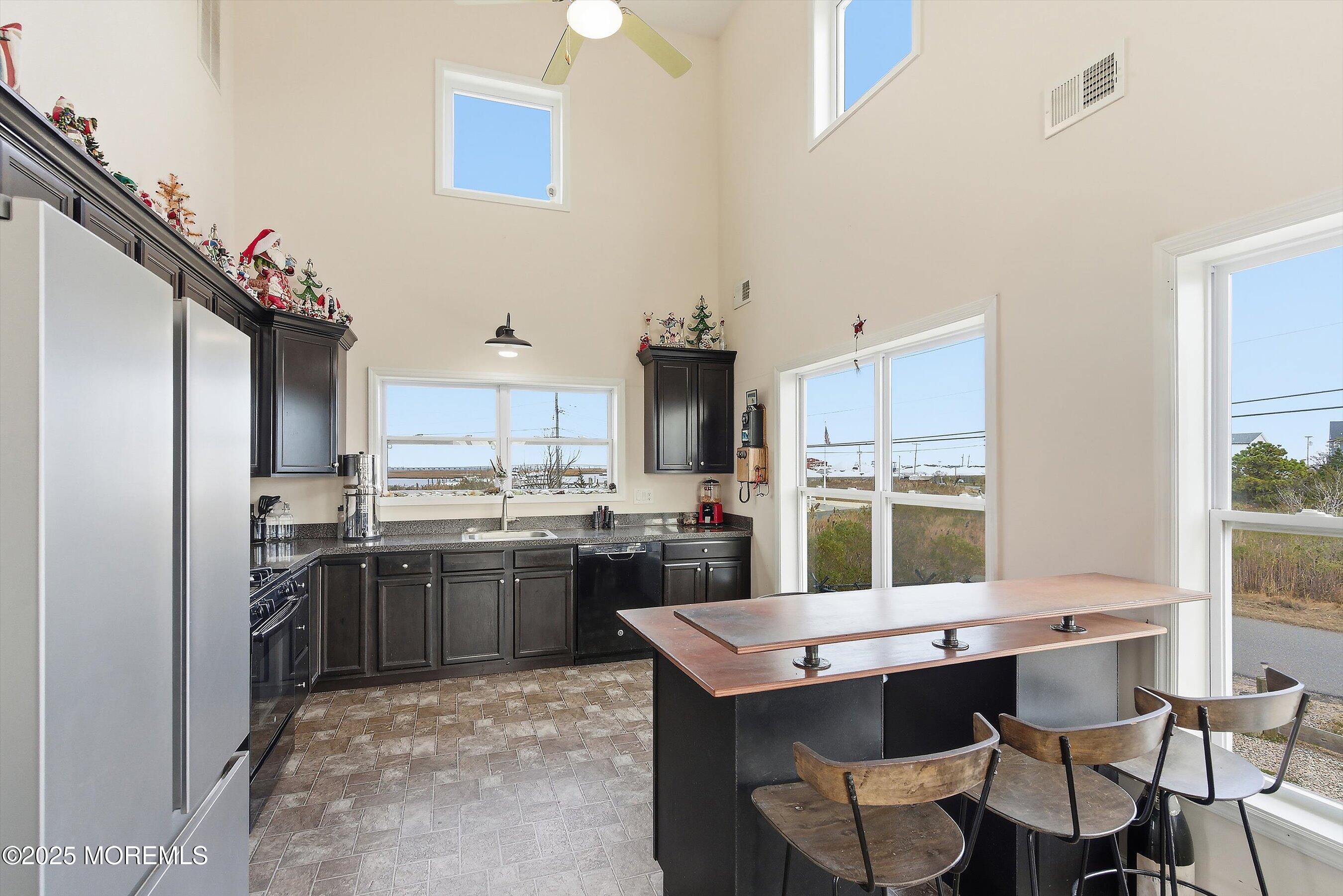 54 Beach Avenue Bayville, NJ 08721 - Photo 13 of 31 a kitchen with a stove and a refrigerator