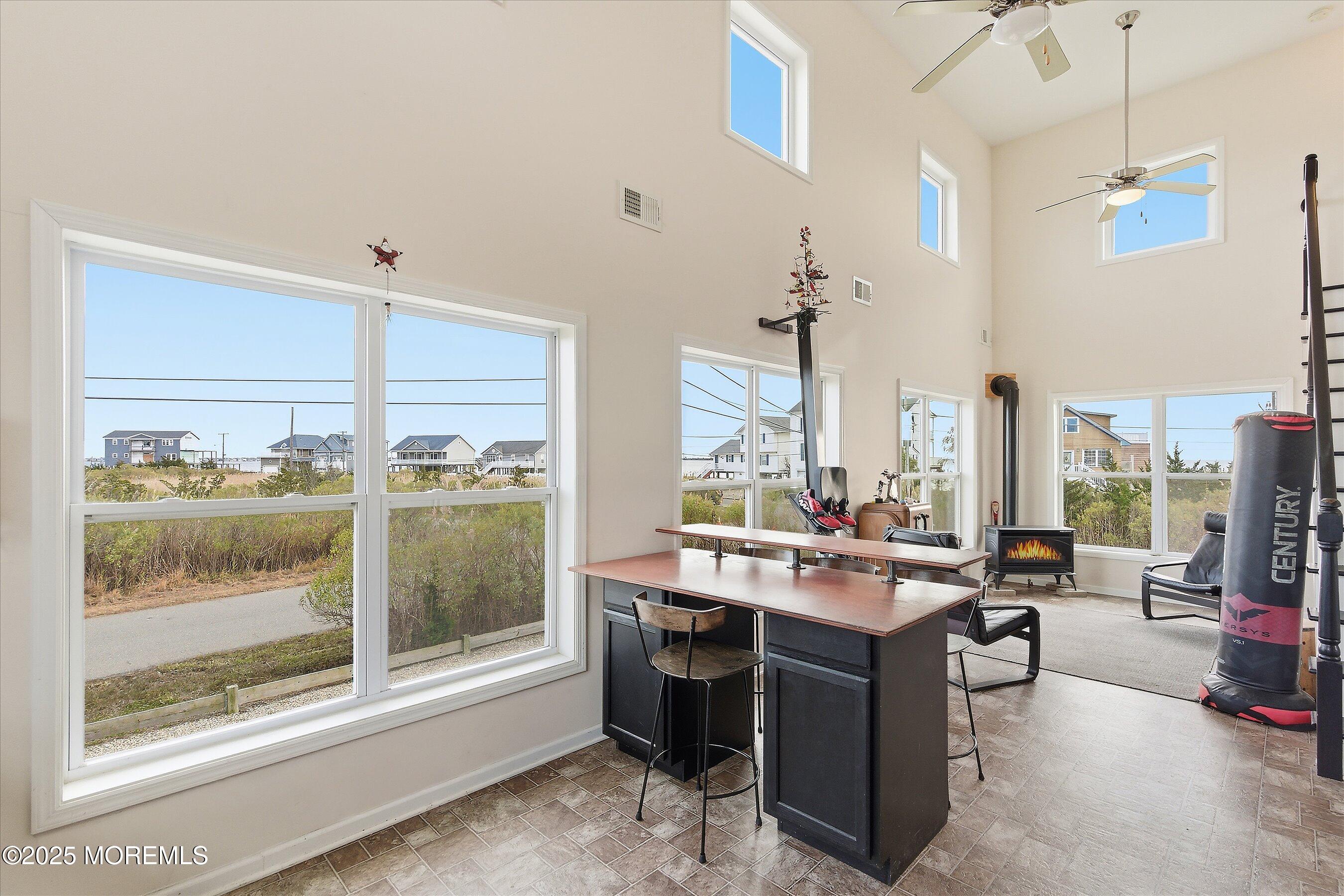 54 Beach Avenue Bayville, NJ 08721 - Photo 15 of 31 a room with a large window and table