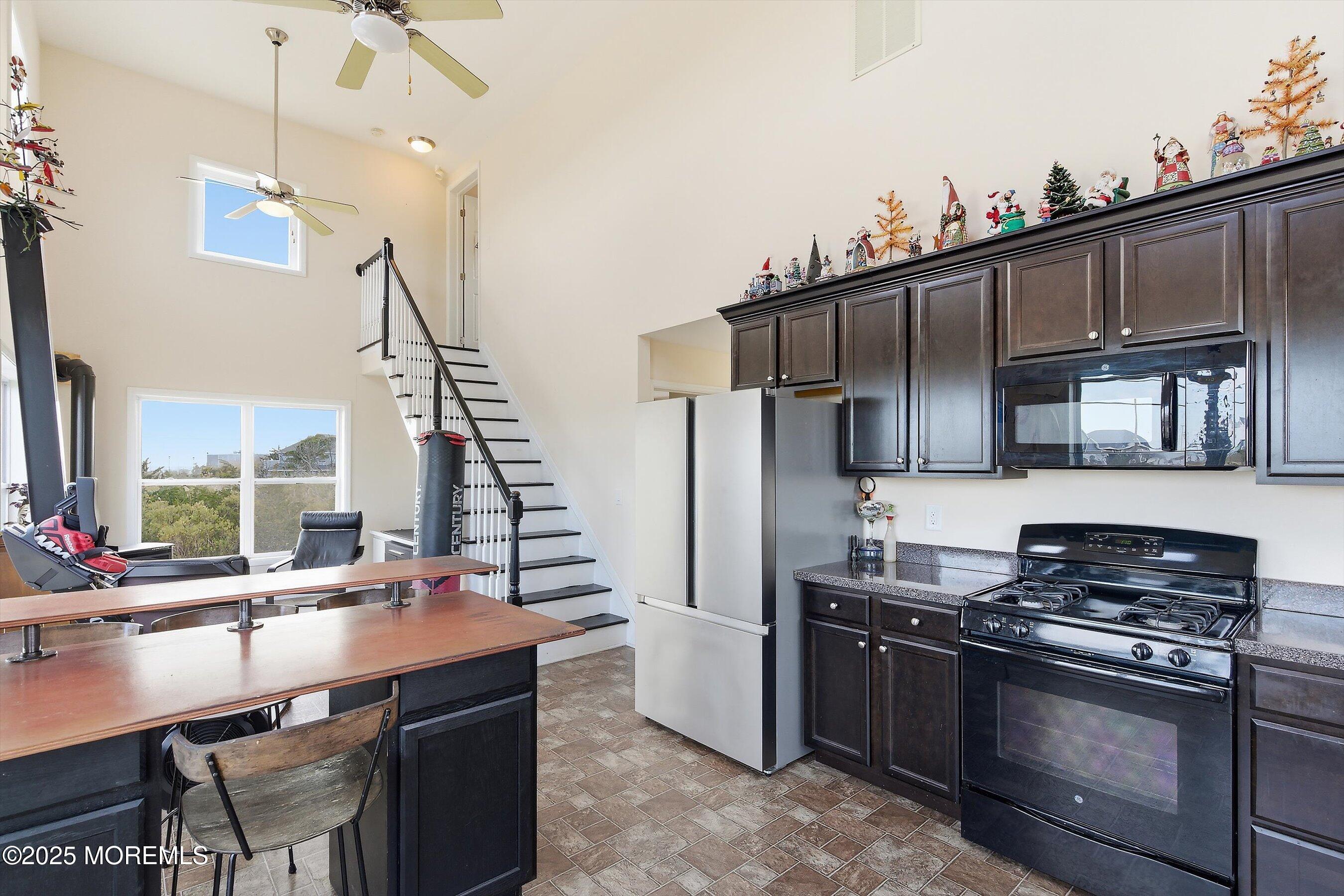 54 Beach Avenue Bayville, NJ 08721 - Photo 16 of 31 a kitchen with stainless steel appliances a sink stove and refrigerator