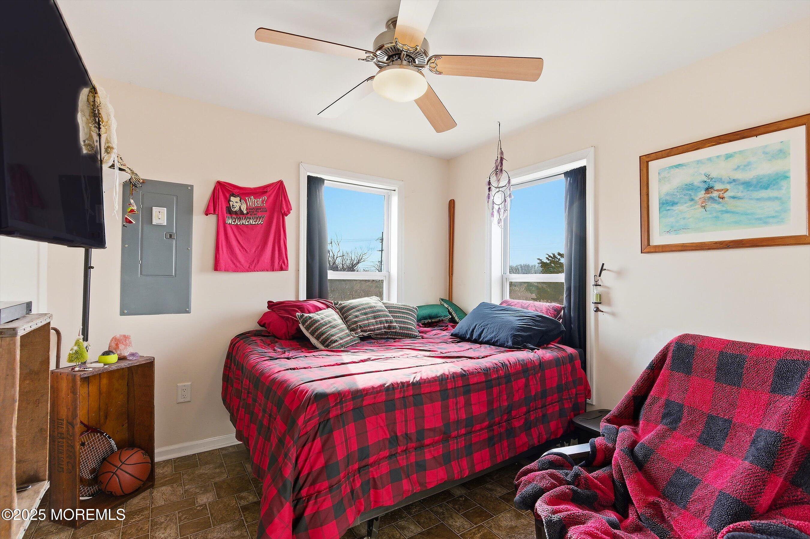 54 Beach Avenue Bayville, NJ 08721 - Photo 19 of 31 a bedroom with two bed and a flat screen tv