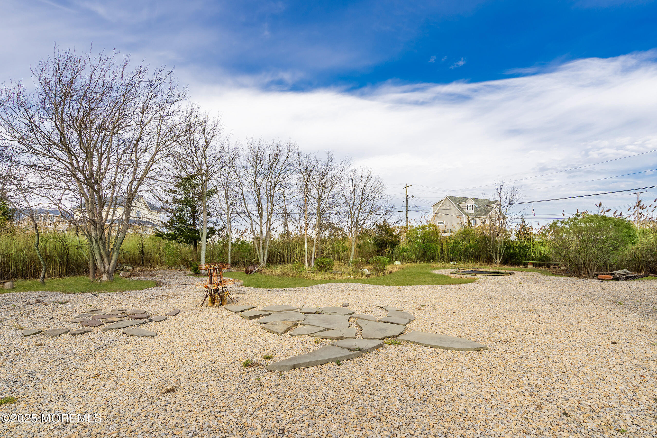 54 Beach Avenue Bayville, NJ 08721 - Photo 23 of 31 a view of dirt yard with a large tree