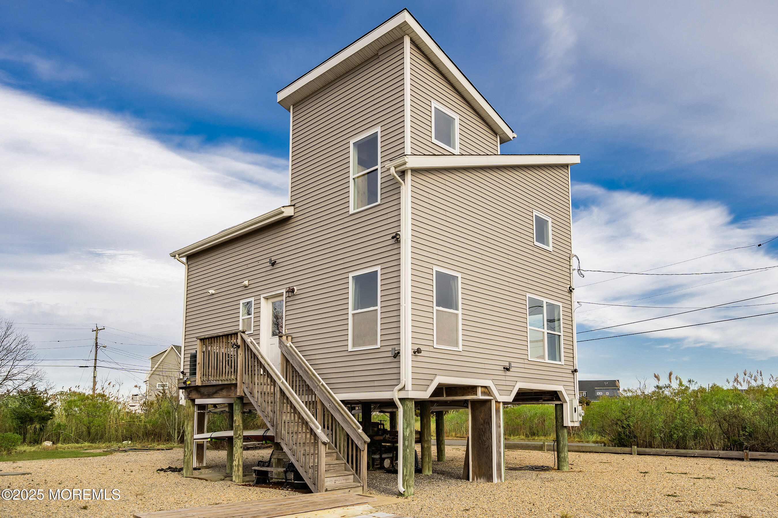 54 Beach Avenue Bayville, NJ 08721 - Photo 6 of 31 a view of a house with a wooden deck