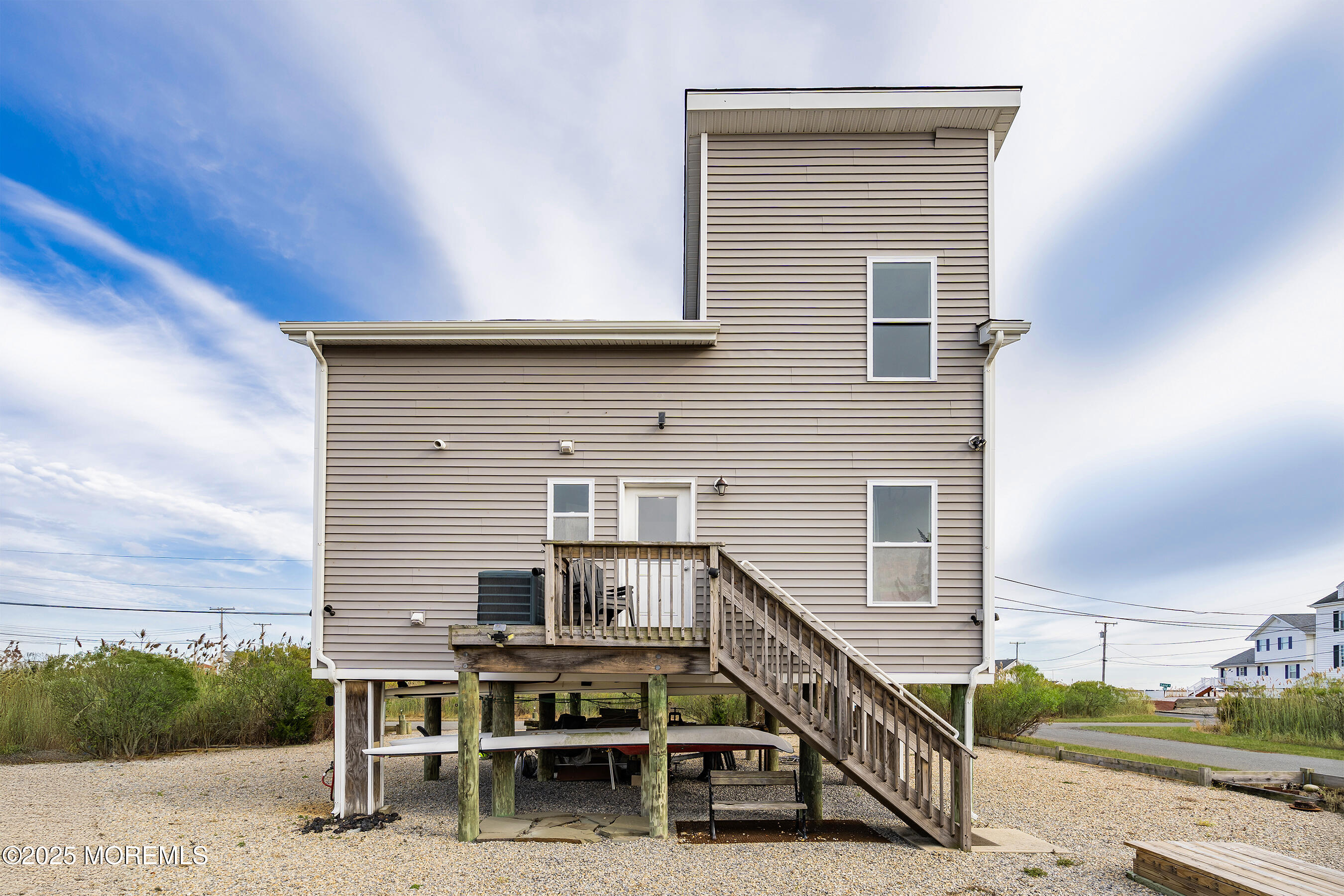 54 Beach Avenue Bayville, NJ 08721 - Photo 9 of 31 a view of a house with wooden deck and furniture