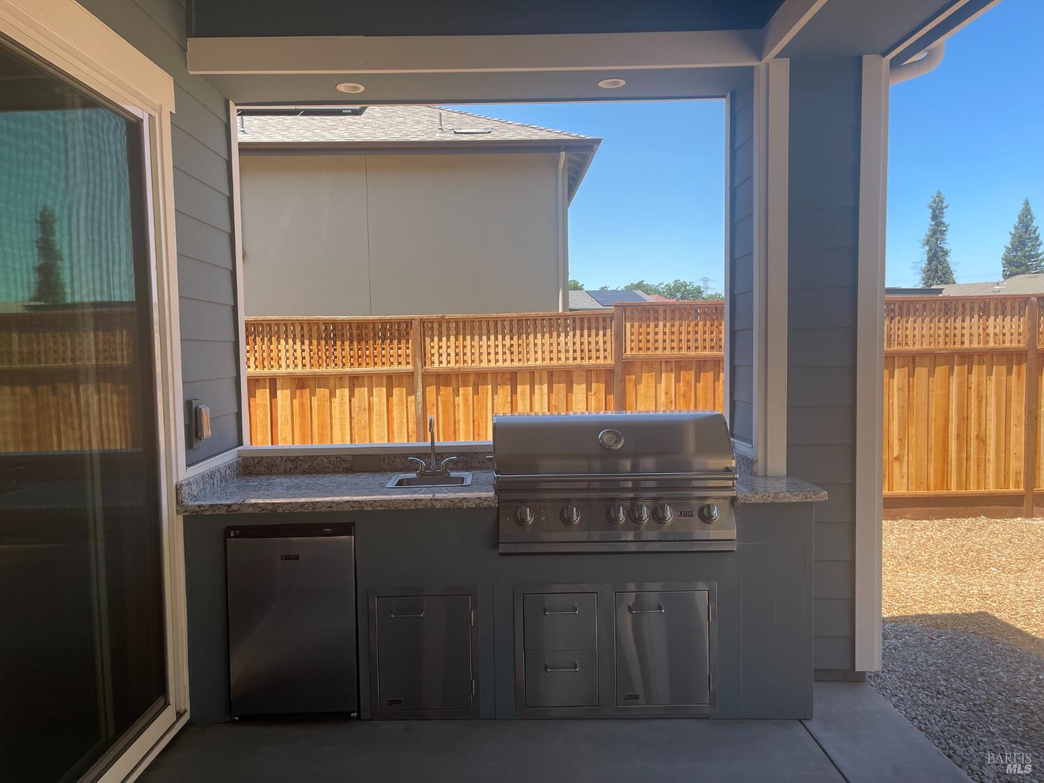 1907 Carlile Place Santa Rosa, CA 95403 - Photo 8 of 10 a kitchen with a sink a window and wooden cabinets