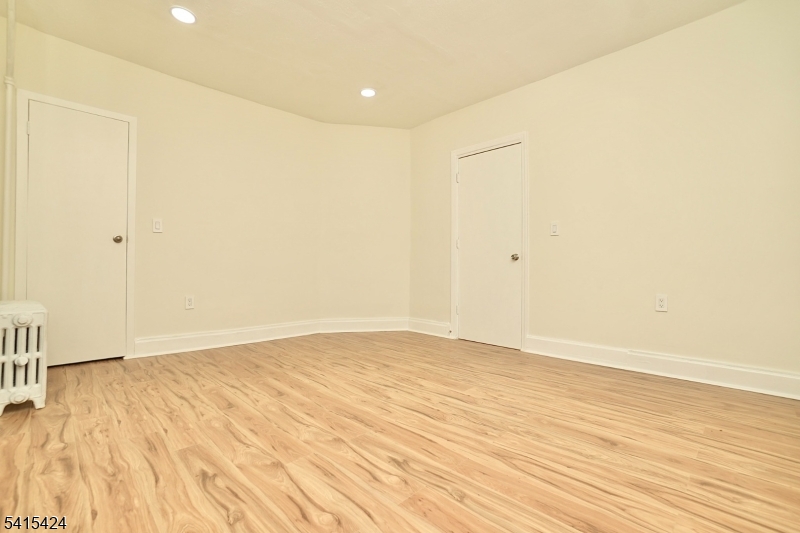 81 Berkeley Avenue Bloomfield, NJ 07003 - Photo 23 of 43 a view of empty room with wooden floor