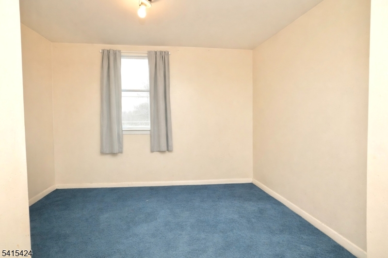 81 Berkeley Avenue Bloomfield, NJ 07003 - Photo 36 of 43 an empty room with a window
