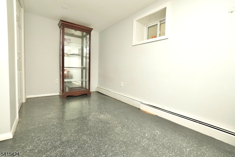 81 Berkeley Avenue Bloomfield, NJ 07003 - Photo 40 of 43 an empty room with windows
