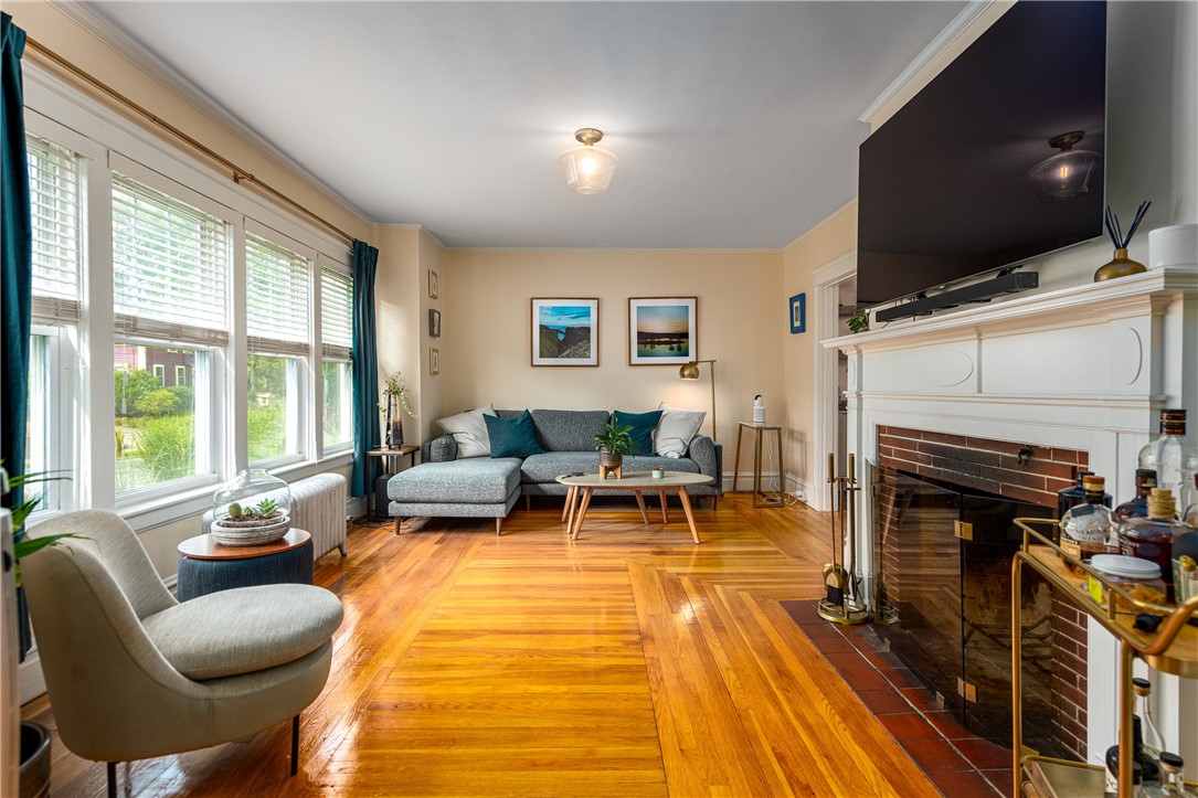 174 Rochambeau Avenue Providence, RI 02906 - Photo 8 of 32 Living room with fireplace.