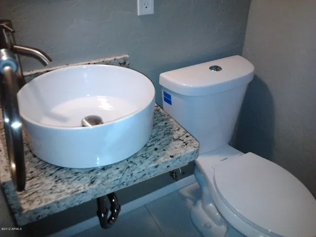 a bathroom with a toilet and a sink
