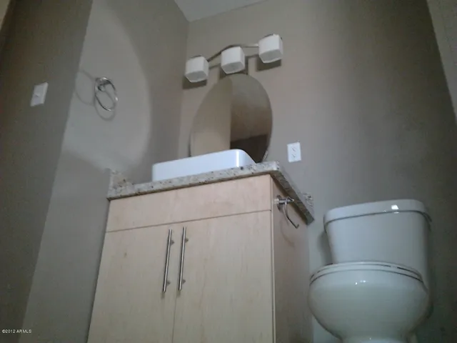 a bathroom with a toilet and a sink