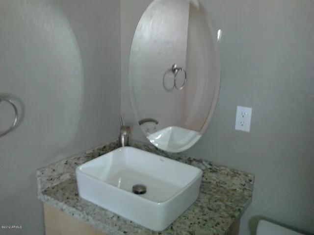 a bathroom with a sink and toilet