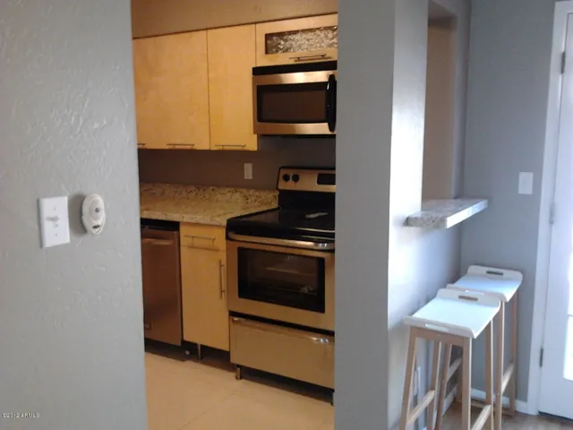 a kitchen with a stove and a microwave