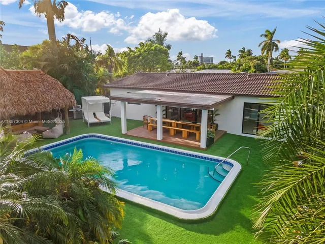 a view of a swimming pool with a patio