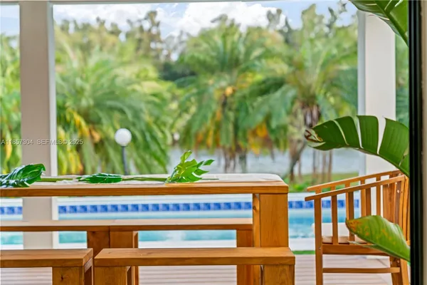 an aerial view of a houses with ocean view