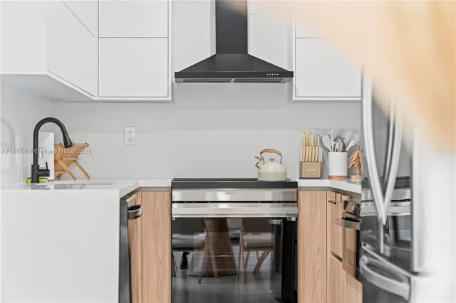 an aerial view of a houses with ocean view