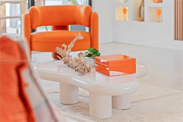 a bedroom with a bed and a potted plant