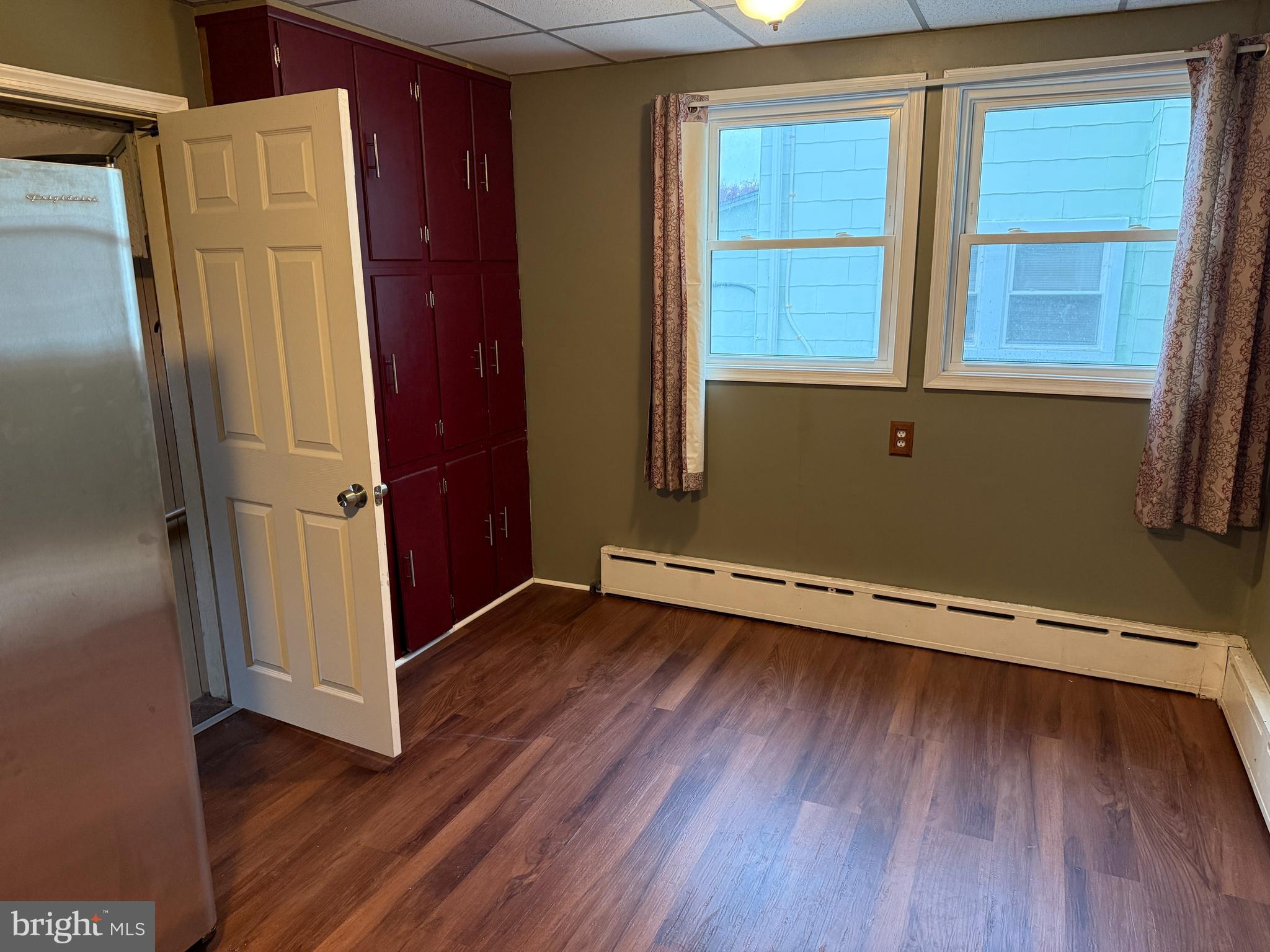 4049 Marshall Road Upper Darby, PA 19026 - Photo 14 of 26 an empty room with wooden floor and a window