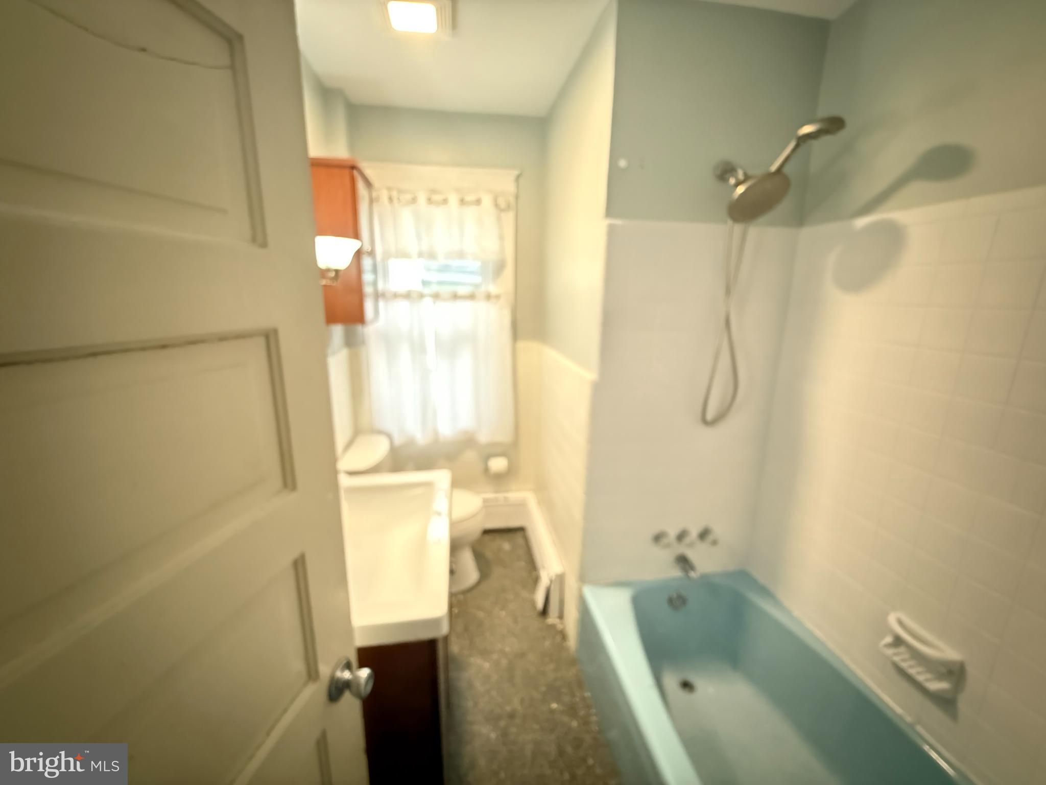 4049 Marshall Road Upper Darby, PA 19026 - Photo 20 of 26 a bathroom with a tub a sink and a shower