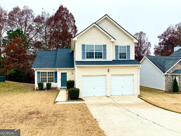 front view of a house with a yard