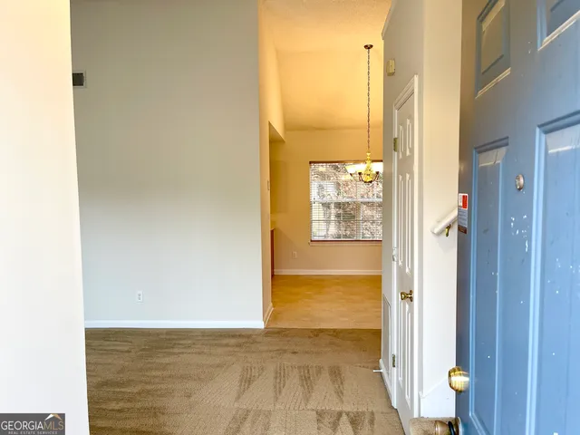 a view of a bathroom with a tub shower and a sink
