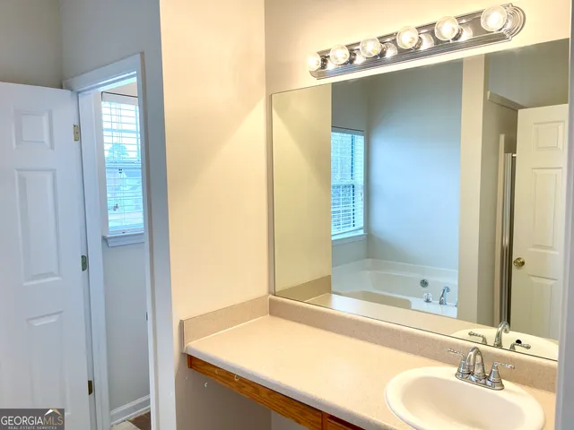 a bathroom with a shower and a bathtub
