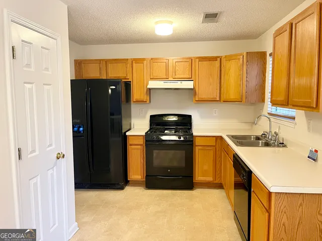 a bedroom with a bed and a fireplace
