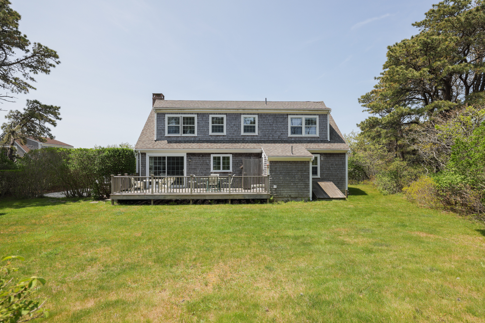 15 Swift Rock Road Nantucket, MA 02554 - Photo 7 of 32 a front view of a house with a garden