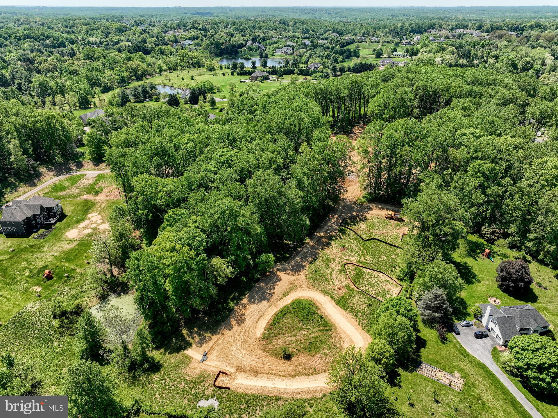 2016 Wilson Road, Unit HAWTHORNE White Hall, MD 21161 - Photo 26 of 28 an aerial view of residential houses with outdoor space and trees